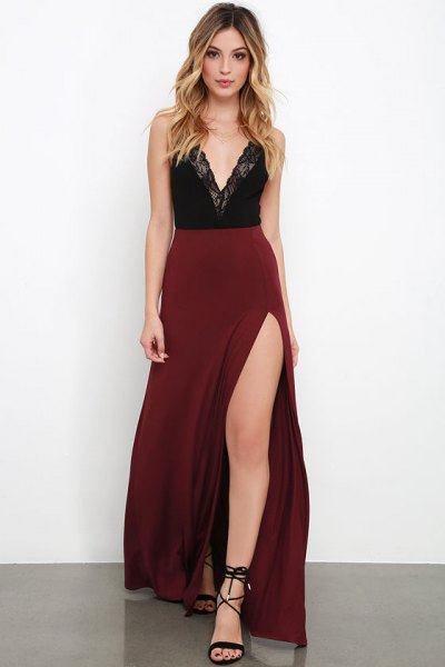 Top with deep V-neck made of black lace and a high-waisted, chestnut brown maxi skirt