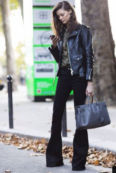 black leather biker jacket with a burgundy shirt and flared jeans
