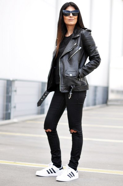 black leather biker jacket with knee-torn slim fit jeans
