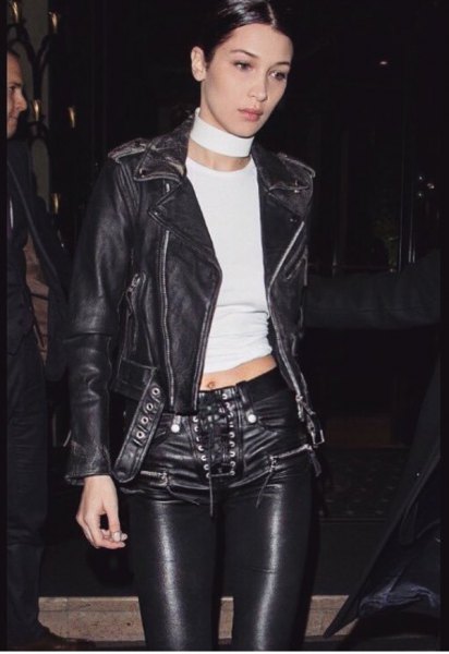 black leather jacket with shortened T-shirt and biker pants