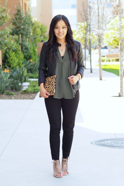 black leather jacket with green blouse made of chiffon with V-neck
