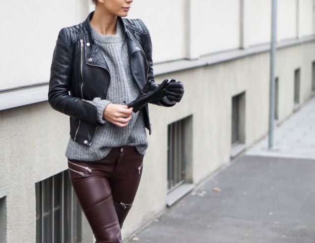 black leather jacket with gray ribbed sweater and moto pants