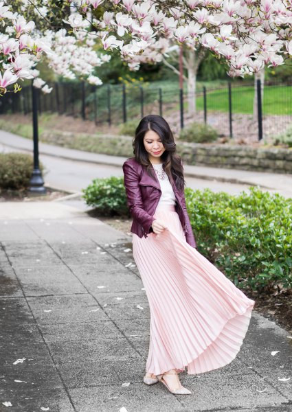 black leather jacket with light pink maxi pleated skirt