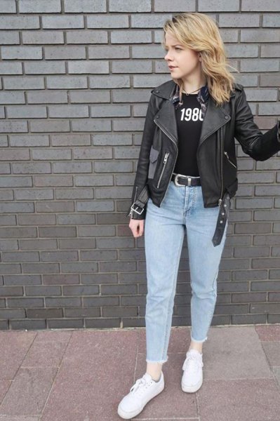 black leather jacket with print T-shirt and light blue mom jeans
