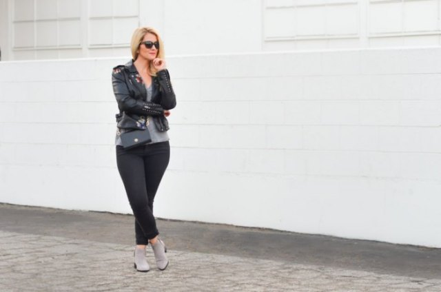 black leather jacket with t-shirt with scoop neckline and gray ankle boots