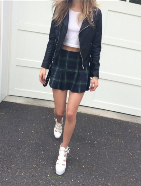 black leather jacket with cropped T-shirt and mini skirt
