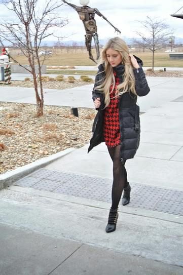 black long puffer coat with red and black checked mini dress