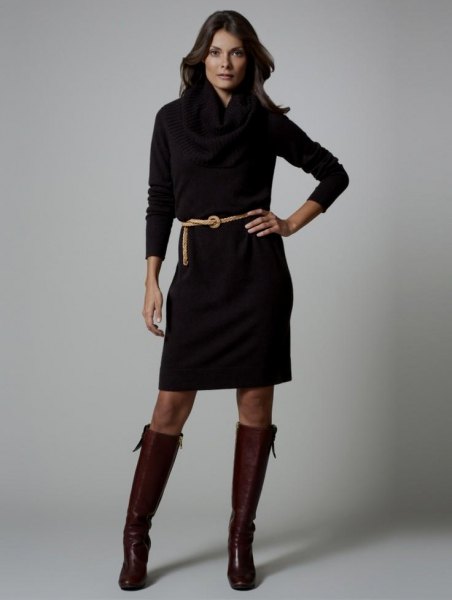 black long-sleeved dress with belt and knee-high leather boots