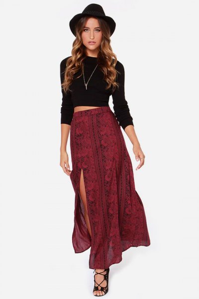 black long-sleeved crop top with red patterned double slit skirt