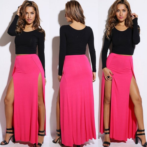 black, long-sleeved, figure-hugging sweater with pink maxi skirt with double slit
