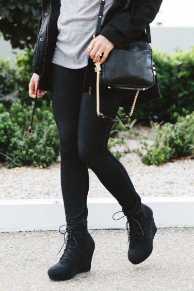 black long trench coat with leggings and wedge boots