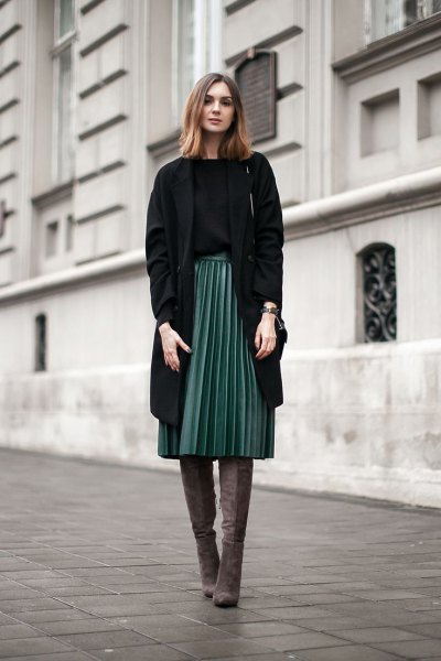 black longline blazer with gray pleated midi skirt and overknee boots