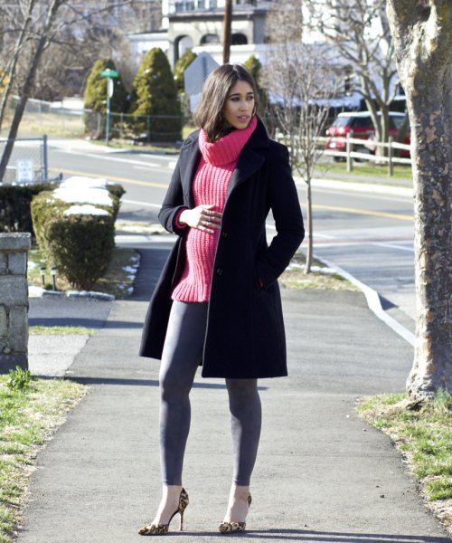black wool coat with red ribbed sweater and gray leggings