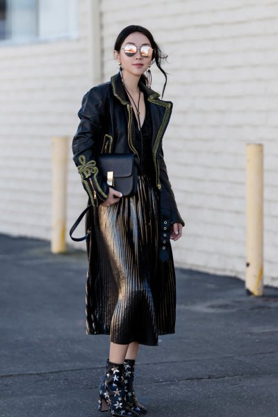 black maxi jacket with pleated midi skirt and star studded ankle boots with heels
