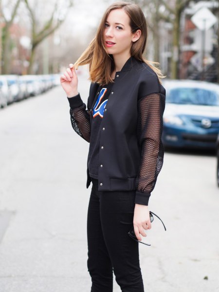 black fishnet jacket with printed T-shirt and skinny jeans