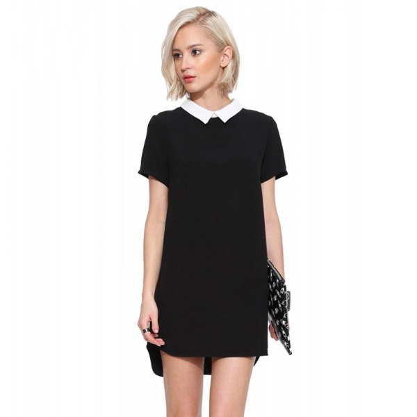 black mini dress with dotted sequin clutch