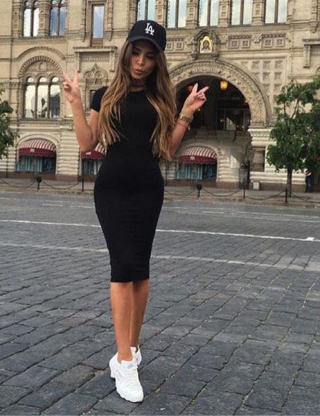 black mini short-sleeved dress with baseball cap and sneakers