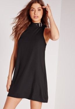 black mini dress with stand-up collar and matching heels with open toes