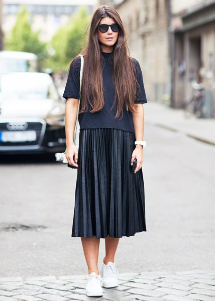 black short-sleeved sweater with stand-up collar and pleated midi skirt
