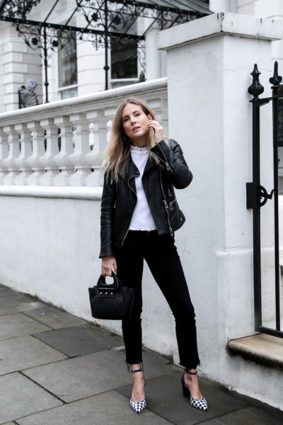 black moto jacket with high-rise jeans and checked heels
