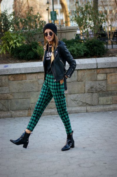 black moto jacket with knitted hat and green, checked, cropped pants
