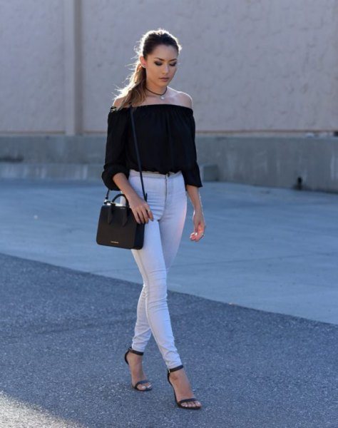 black, off-the-shoulder, cropped blouse with white skinny jeans with a high waist