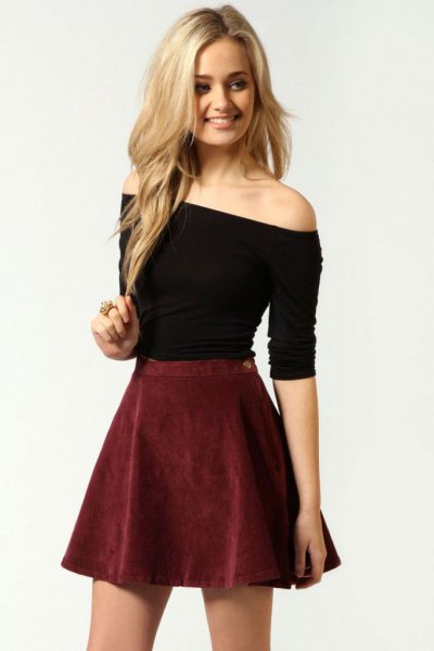 Shoulder-free top in black with a burgundy suede skirt