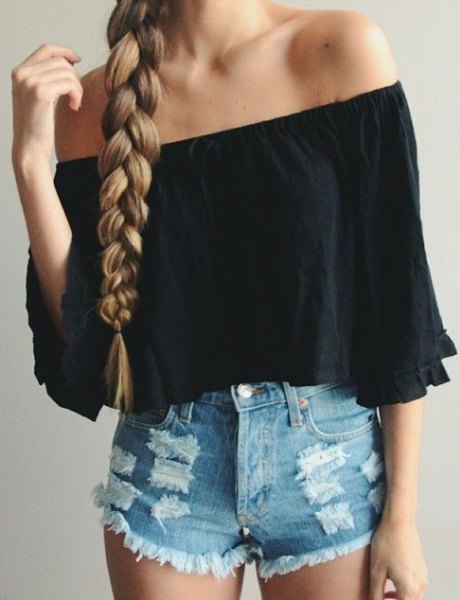 Black off shoulder shirt with half sleeves and blue shorts with mini denim tear