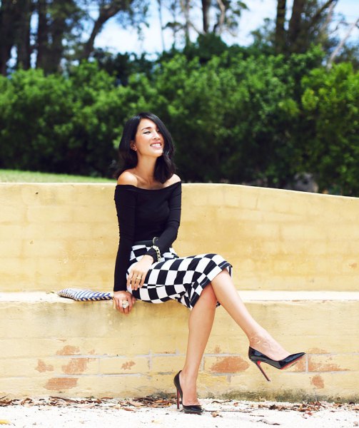 Black strapless top with checked, figure-hugging midi skirt
