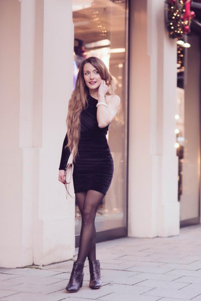 black strapless mini dress with stockings and leather boots