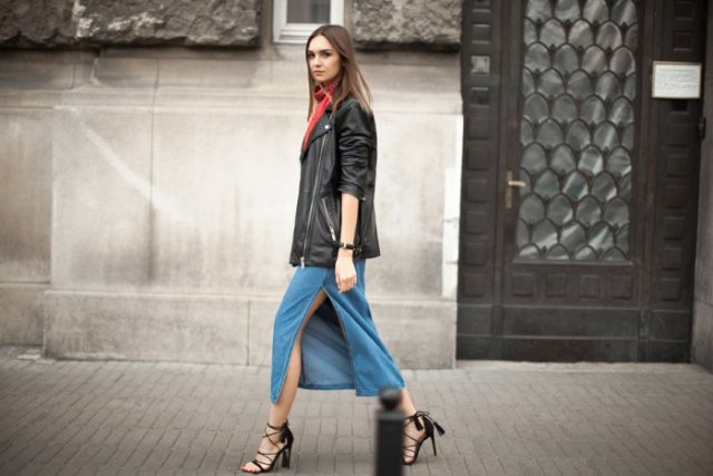 black oversized leather jacket with blue midi denim skirt with high slit