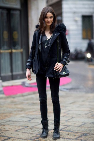 black parka jacket with leather details and ankle boots