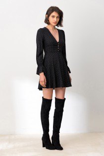 black skater mini dress with puff sleeves and overknee boots