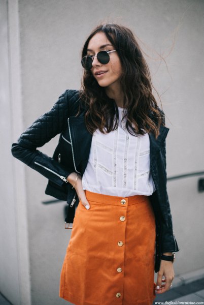 black quilted leather jacket with orange suede skirt