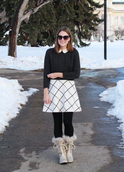 black ribbed sweater with a white printed skater skirt