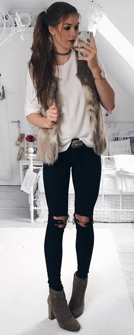 trendy outfit / fur jacket + top + black ripped jeans + boots .
