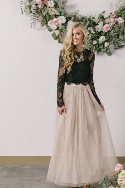 black lace top with scalloped hem and floor-length skirt made of light pink tulle