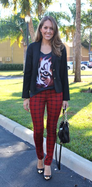 black graphic t-shirt with scoop neckline, casual blazer and red checked pants