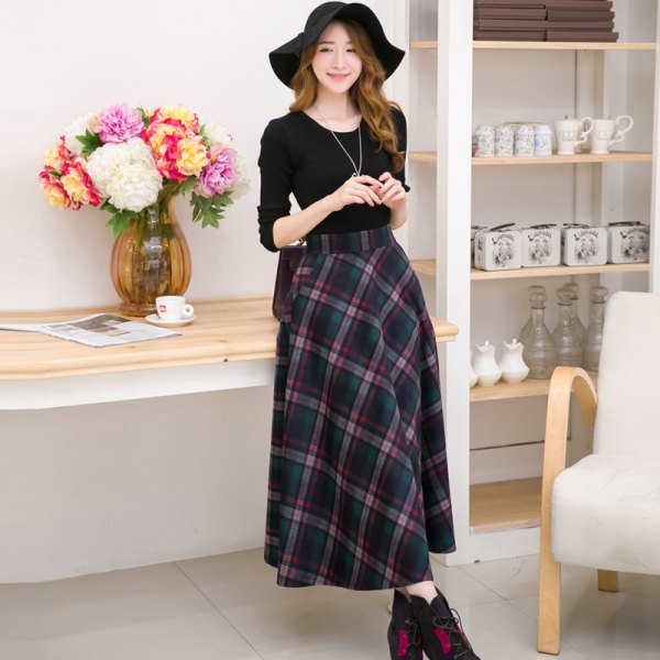black long-sleeved t-shirt with scoop neckline and maxi-gray checked wool skirt