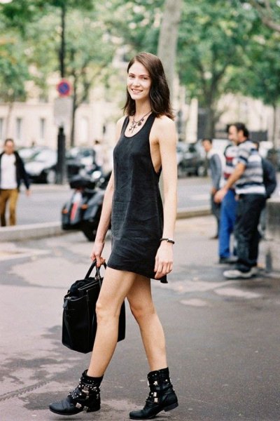 black mini tank sheath dress with scoop neckline and biker leather boots