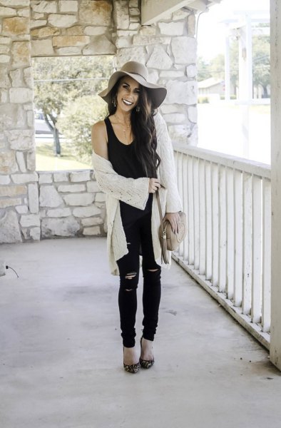 black tank top with scoop neck, white cardigan and floppy cap