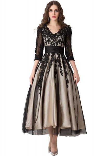 black, semi-transparent dress with three-quarter sleeves and floor-length dress with a lace V-neckline