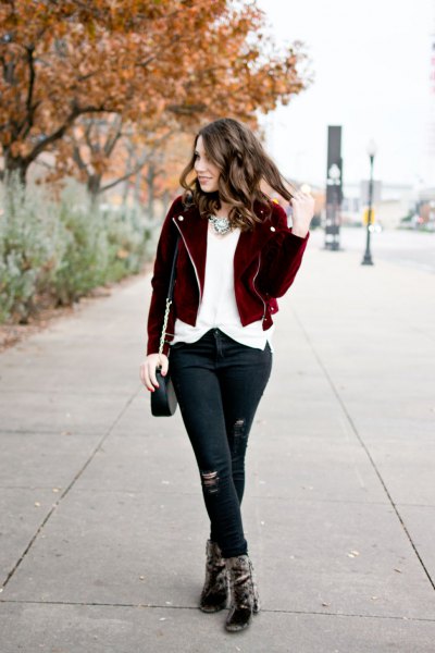black short jacket with white chiffon blouse and ripped jeans