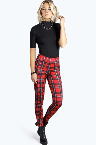 black short-sleeved sweater with mock neck and red checked trousers