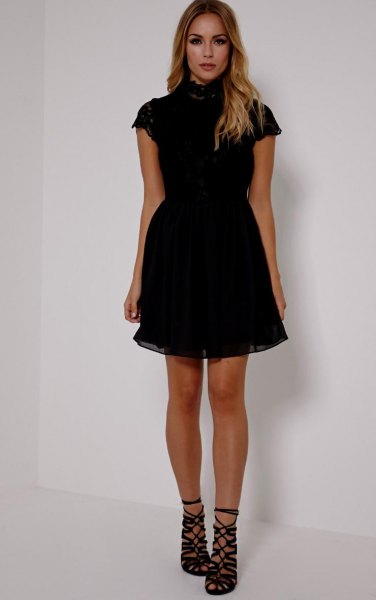 black short-sleeved tulle dress with a high neck