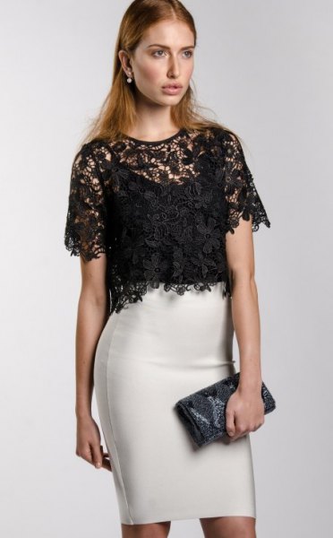 black, short-sleeved, elegant lace blouse with white mini skirt