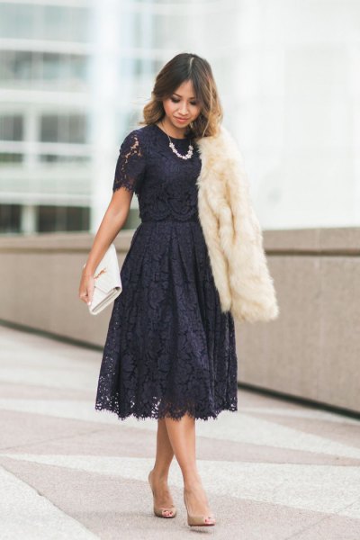 black short-sleeved lace fit dress and flared midi dress with white faux fur coat