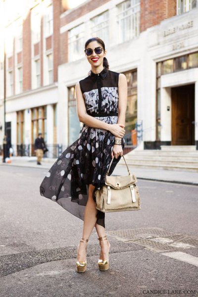 black sleeveless blouse with dotted chiffon mini skirt and gold sandals