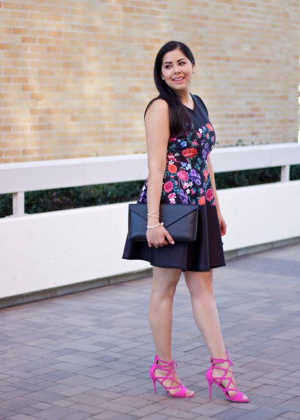 black sleeveless mini swing dress embroidered with flowers with pink strappy heels