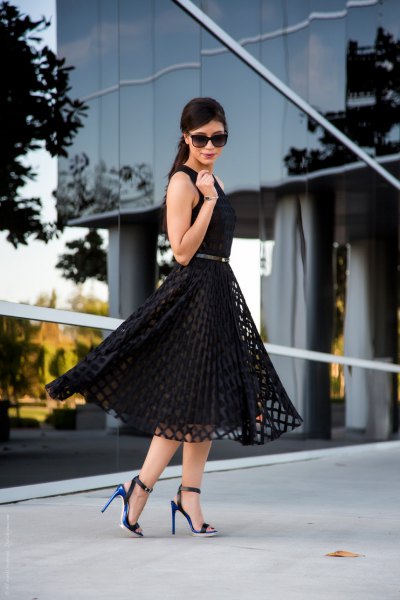 black sleeveless medium-length flare dress with open toe heels